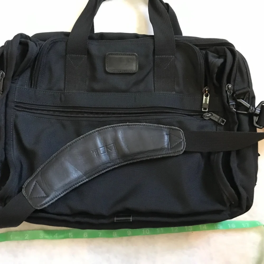 Tumi Black expandable laptop bag. Preowned in excellent condition